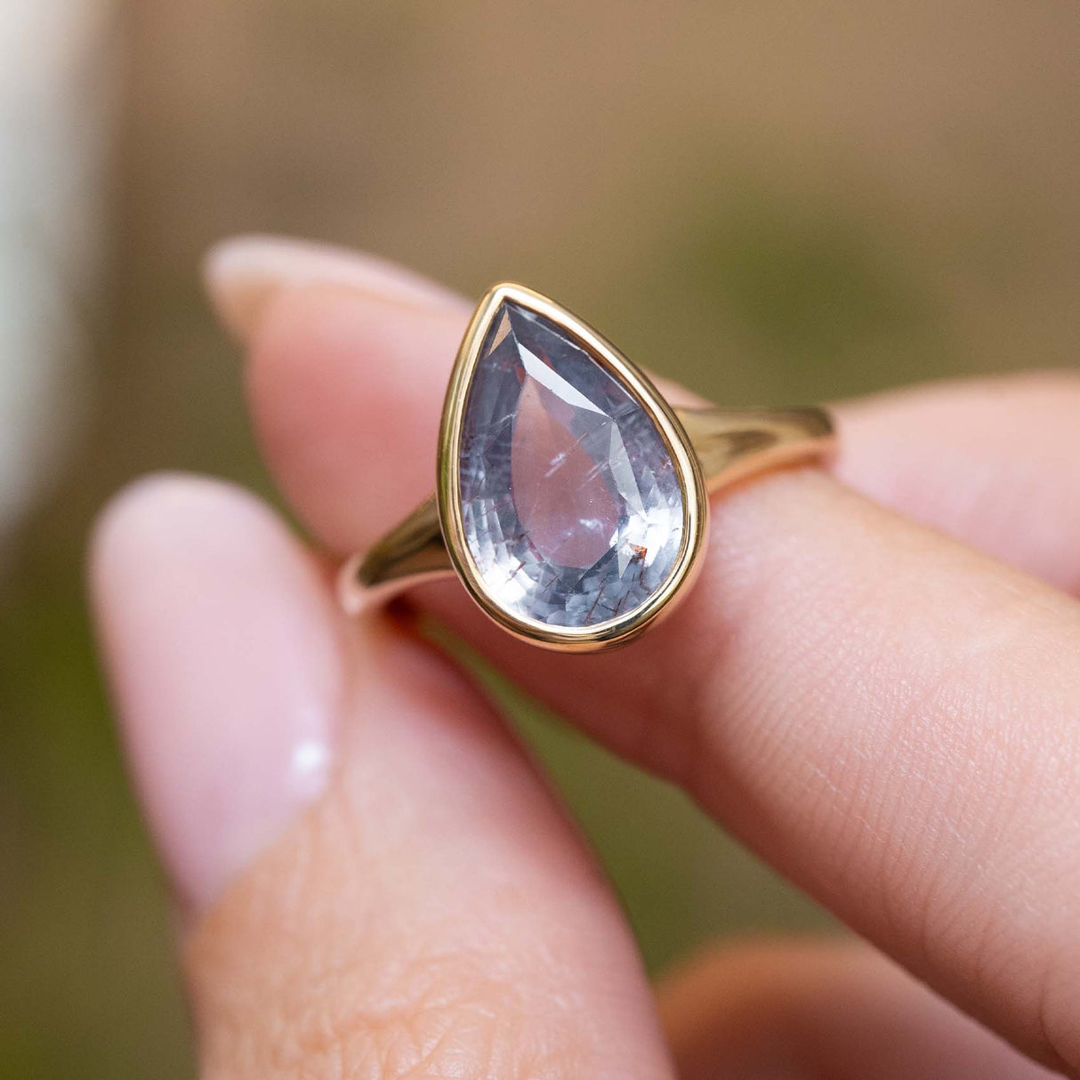 Antique-inspired, blue-grey colour change sapphire solitaire ring
