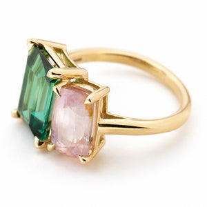 A yellow gold Vintage-inspired, Green tourmaline and pink sapphire Two stone engagement ringring featuring claw prong settings, shown on a clean white background.