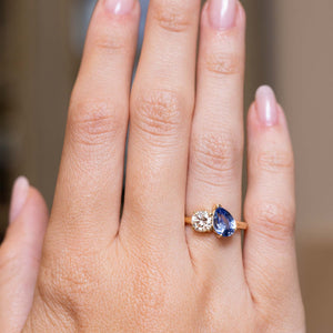 Photograph of antique-inspired blue sapphire and diamond engagement ring shown at full scale