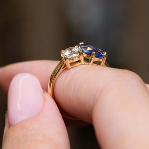 Side profile of the sapphire and diamond settings on a yellow gold band