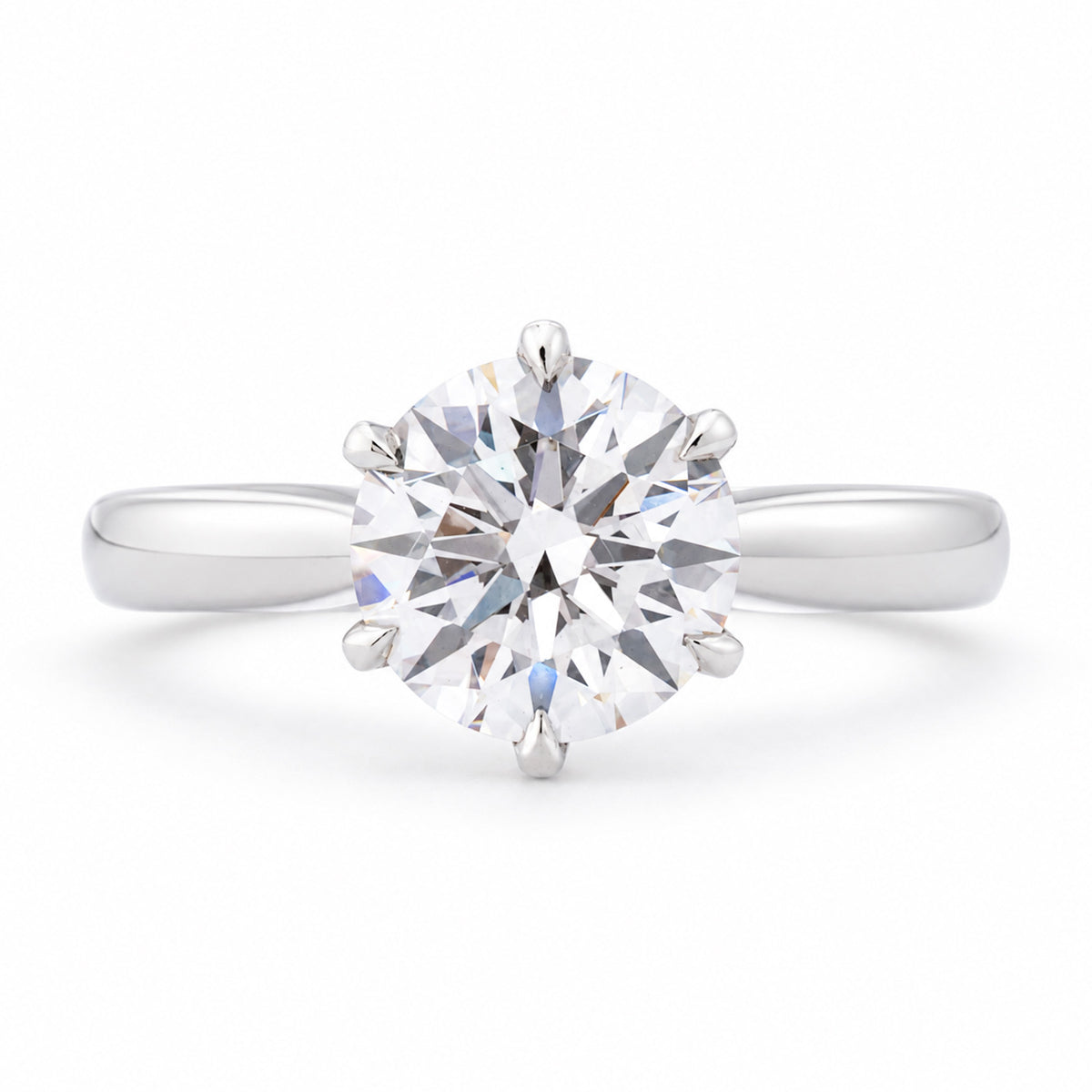 Front profile of a vintage lab-grown brilliant-cut diamond solitaire engagement ring in polished white gold.