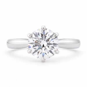 Front profile of a vintage lab-grown brilliant-cut diamond solitaire engagement ring in polished white gold.