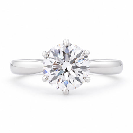 Front profile of a vintage lab-grown brilliant-cut diamond solitaire engagement ring in polished white gold.