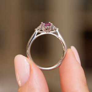 Profile view of an antique-style sapphire and diamond ring, showing the sculptural platinum gallery and polished band
