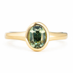 Antique-inspired, green sapphire solitaire engagement ring