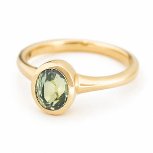 Antique-inspired, green sapphire solitaire engagement ring