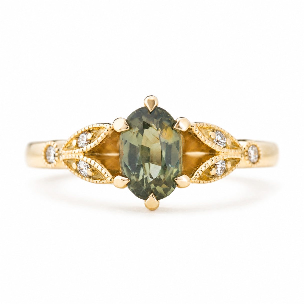 Vintage-inspired, Green sapphire and diamond engagement ring against a plain white background