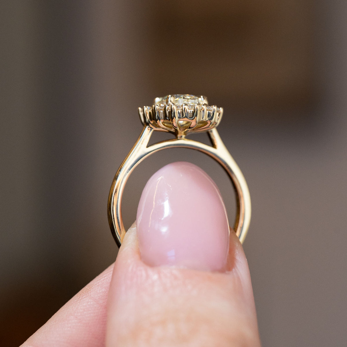 Side profile of the antique-inspired cluster engagement ring, revealing its raised diamond setting and elegant yellow gold band.