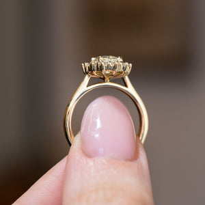 Side profile of the antique-inspired cluster engagement ring, revealing its raised diamond setting and elegant yellow gold band.