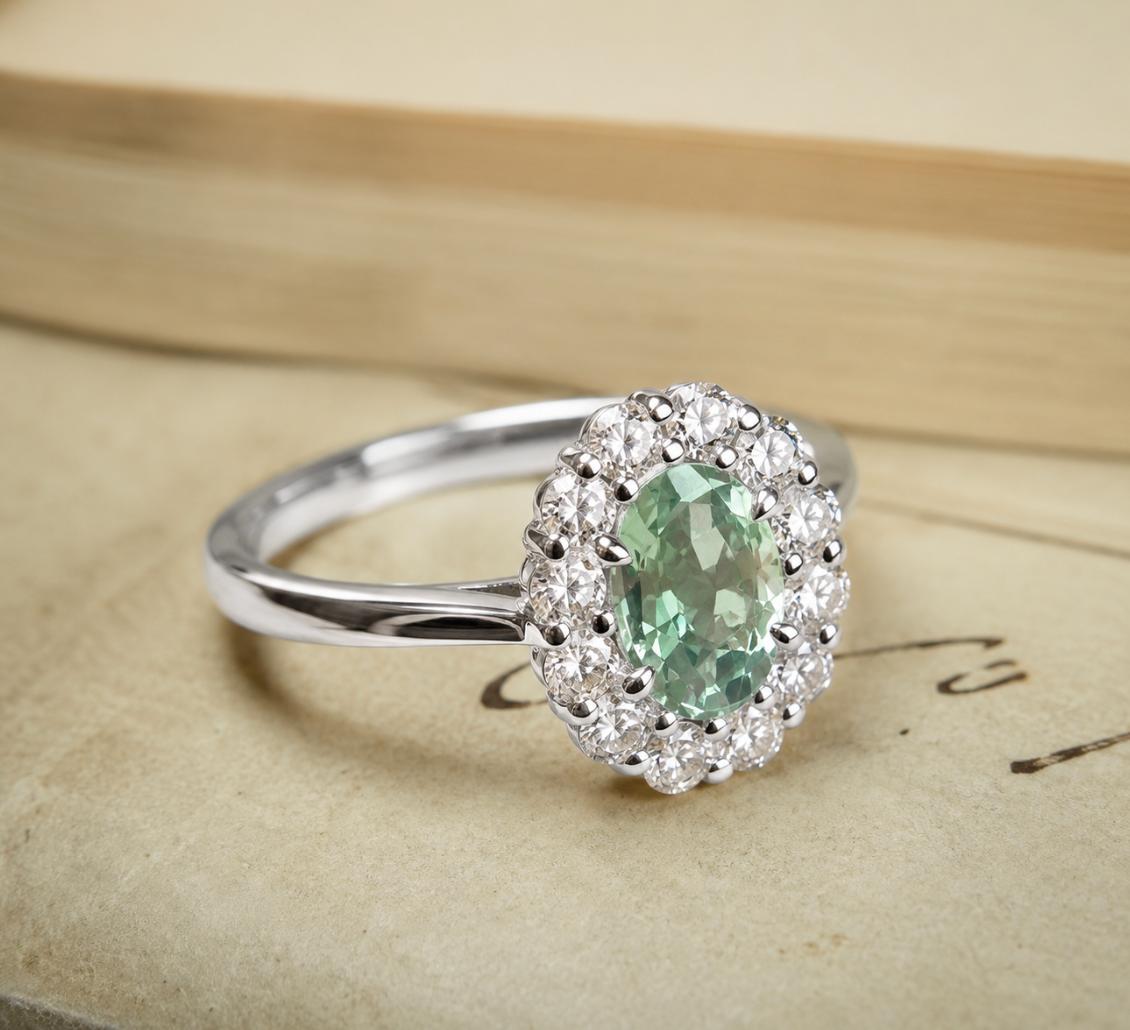 Vintage-inspired, green sapphire and diamond cluster engagement ring