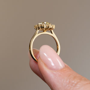 Side profile of the antique-inspired diamond cluster ring, revealing the raised gallery and polished yellow gold band.