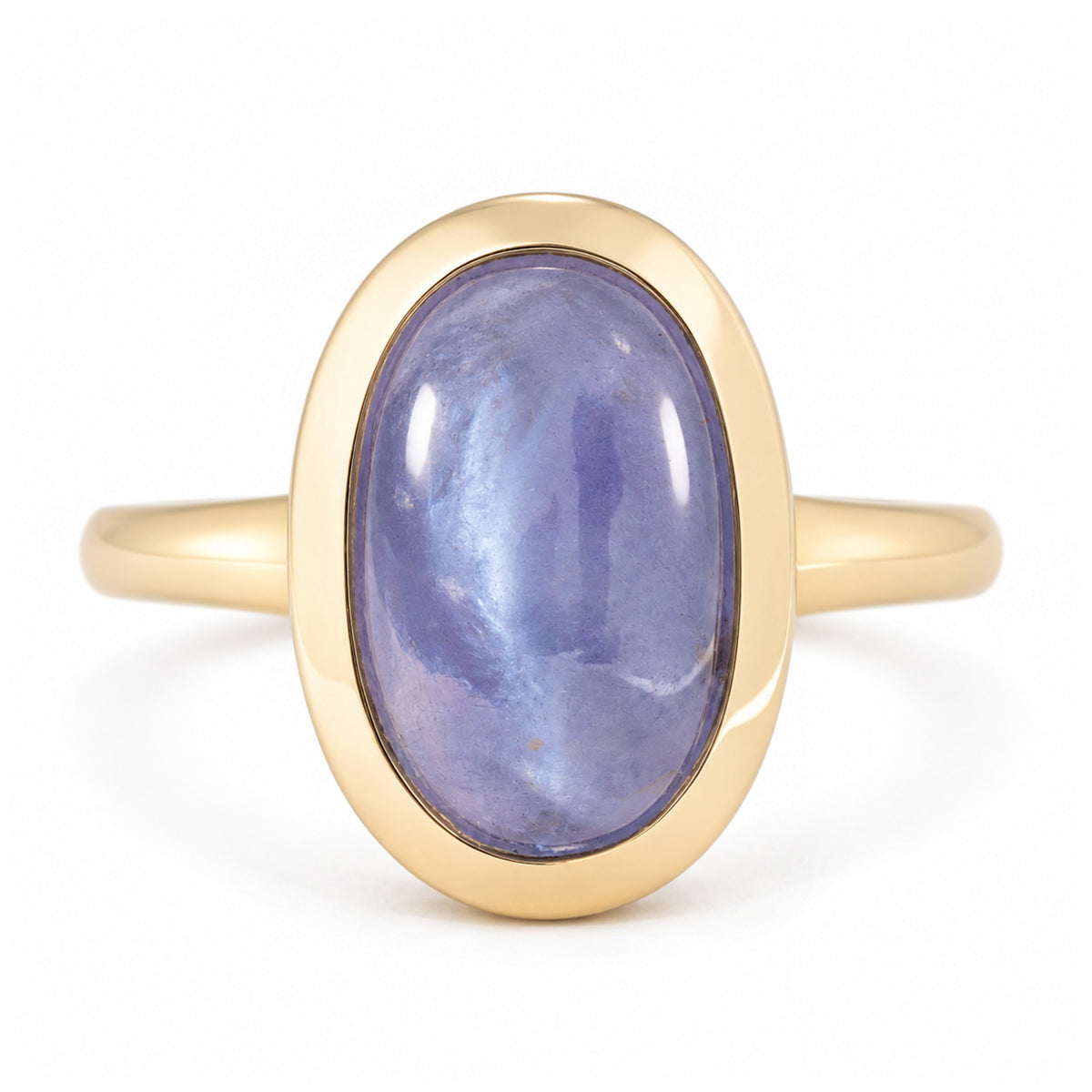 Antique-inspired cat's eye sapphire solitaire engagement ring in yellow gold, featuring an oval blue-purple cabochon gemstone in a smooth bezel setting.