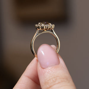 Side profile of the antique-inspired diamond cluster ring, revealing the raised gallery and polished yellow gold band.