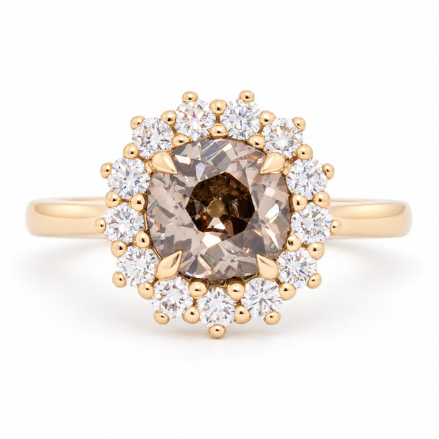 Antique-inspired smoky cognac old-mine diamond cluster engagement ring in yellow gold, surrounded by a halo of sparkling white diamonds.