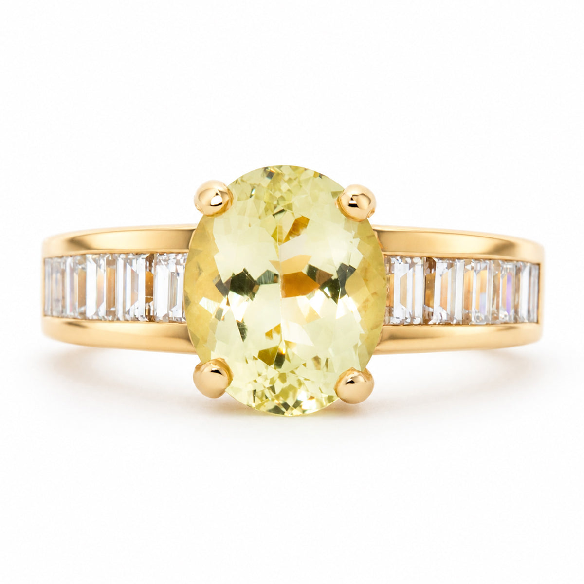 Front view of a vintage 1980s green beryl and diamond engagement ring in 18ct yellow gold, with an oval-cut centre stone and baguette diamond shoulders.