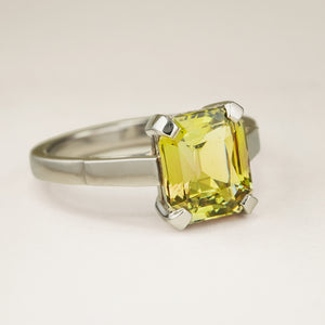 Green and brown colour-change sapphire solitaire engagement ring