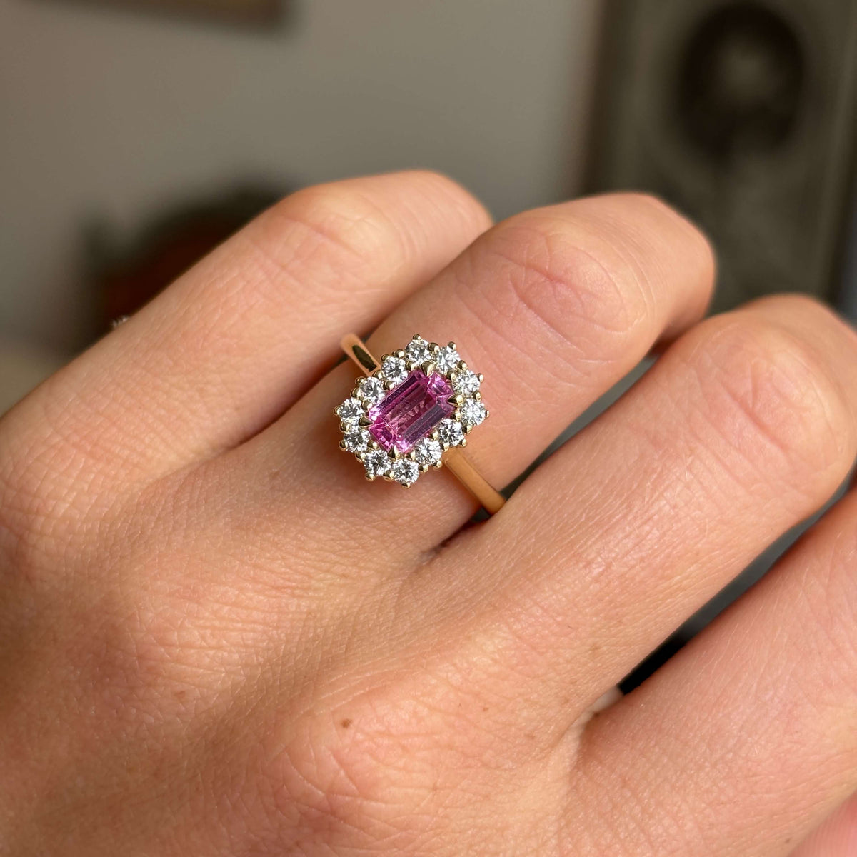 Antique-inspired, pink sapphire and diamond cluster engagement ring