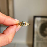 Vintage-inspired, sage green sapphire and diamond engagement ring