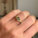 Vintage-inspired, sage green sapphire and diamond engagement ring