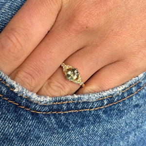 Vintage-inspired, sage green sapphire and diamond engagement ring