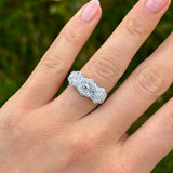 Vintage, 1970s cubic zirconia triple cluster ring worn on hand