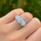 Vintage, 1970s cubic zirconia triple cluster ring worn on hand.