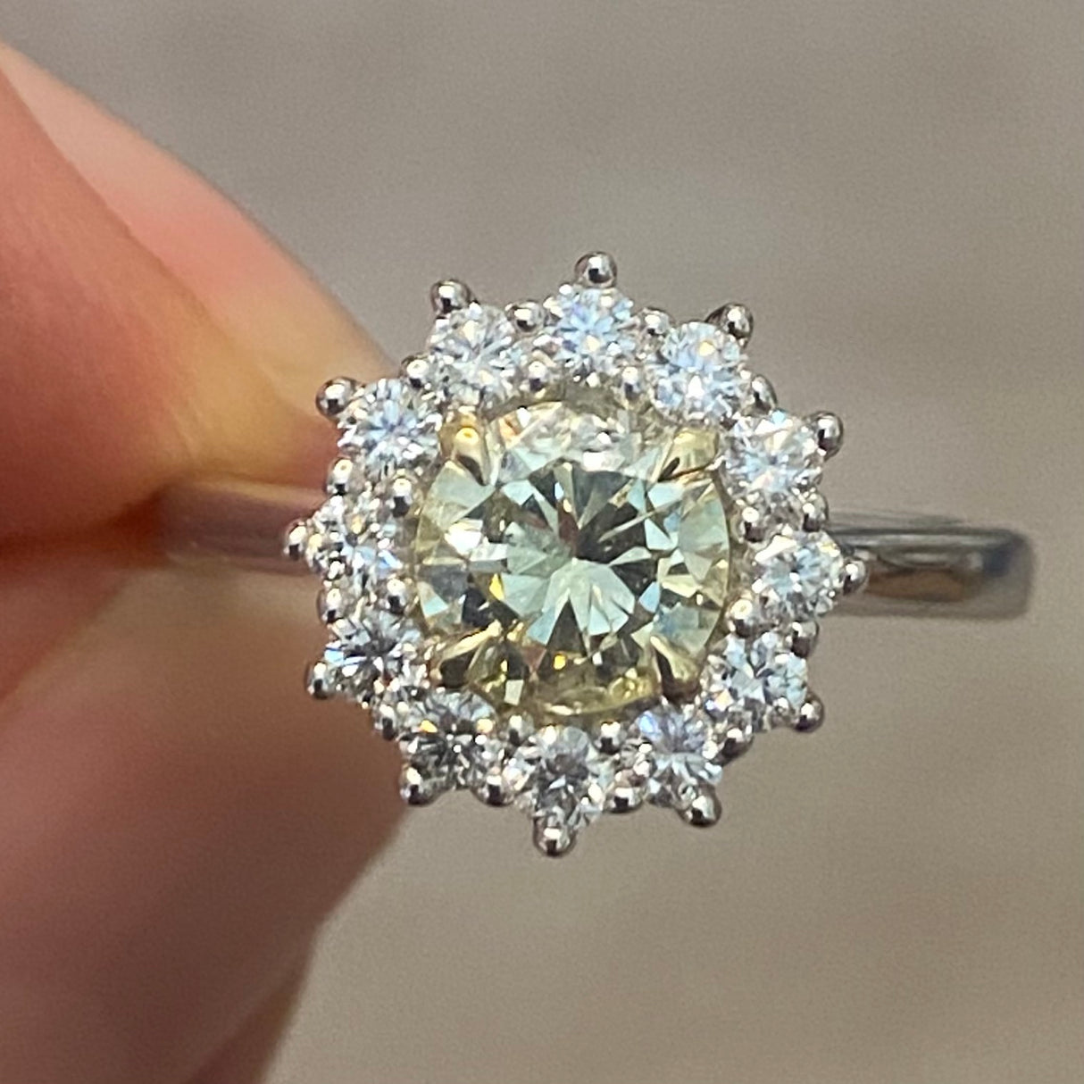Tinted yellow 1.01ct diamond cluster engagement ring