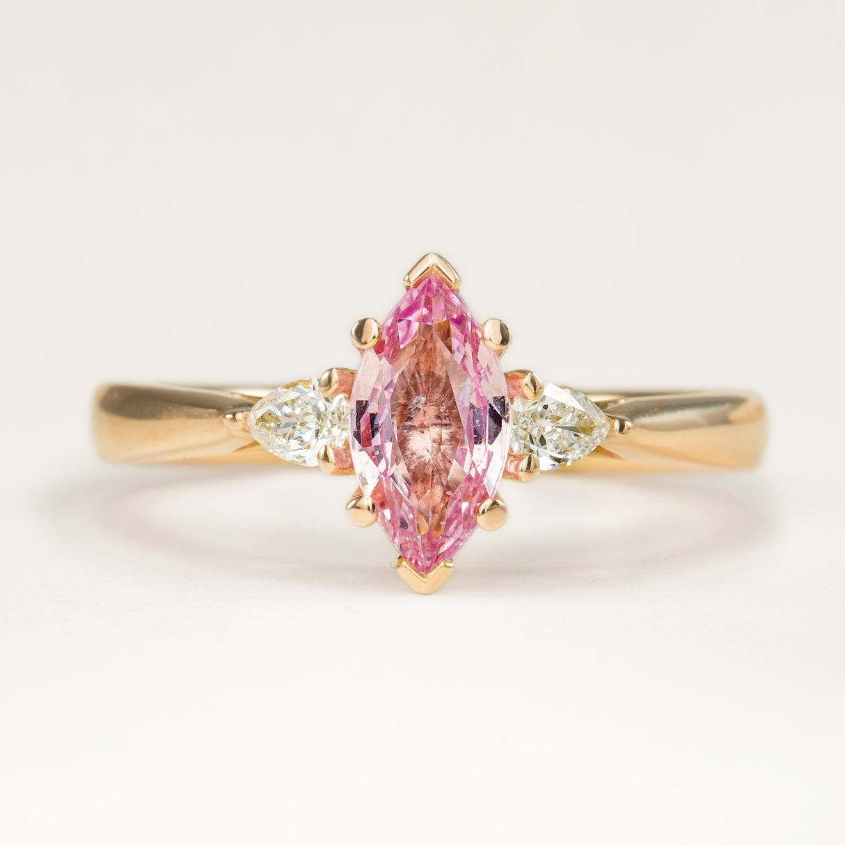 Marquise-cut Padparascha Pink sapphire and diamond three-stone engagement ring