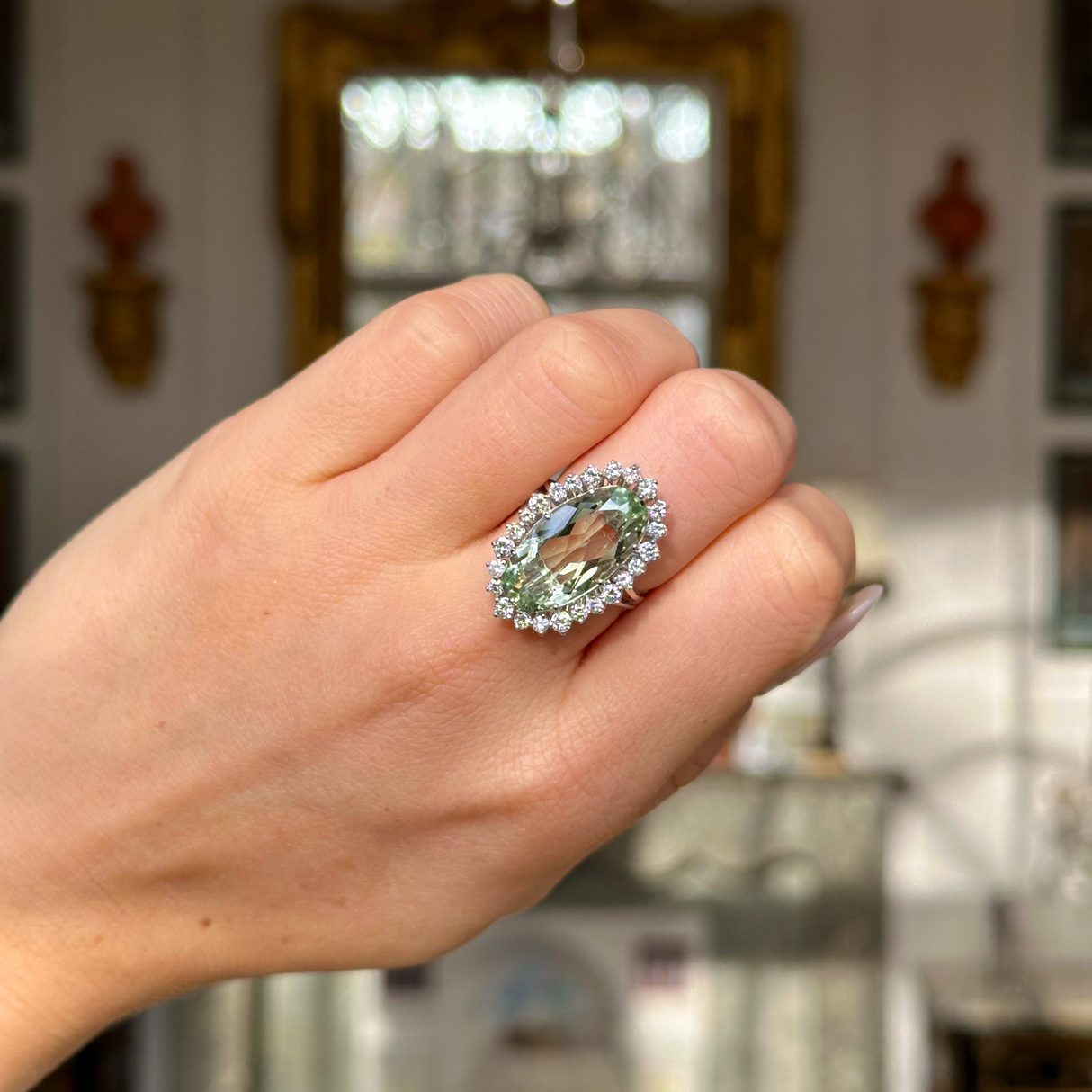 vintage mint green quartz and diamond cluster cocktail ring worn on closed hand. 