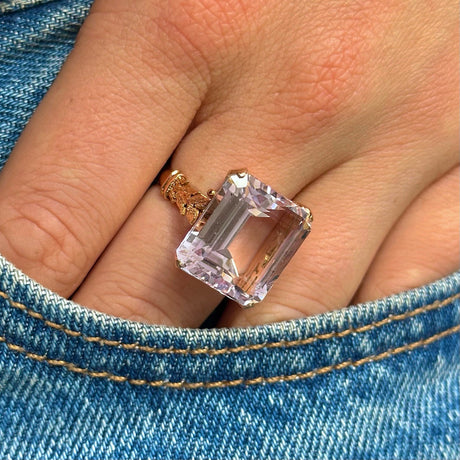 Morganite cocktail ring, worn on hand in pocket of jeans.