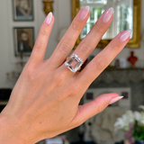 Morganite cocktail ring worn on hand. 