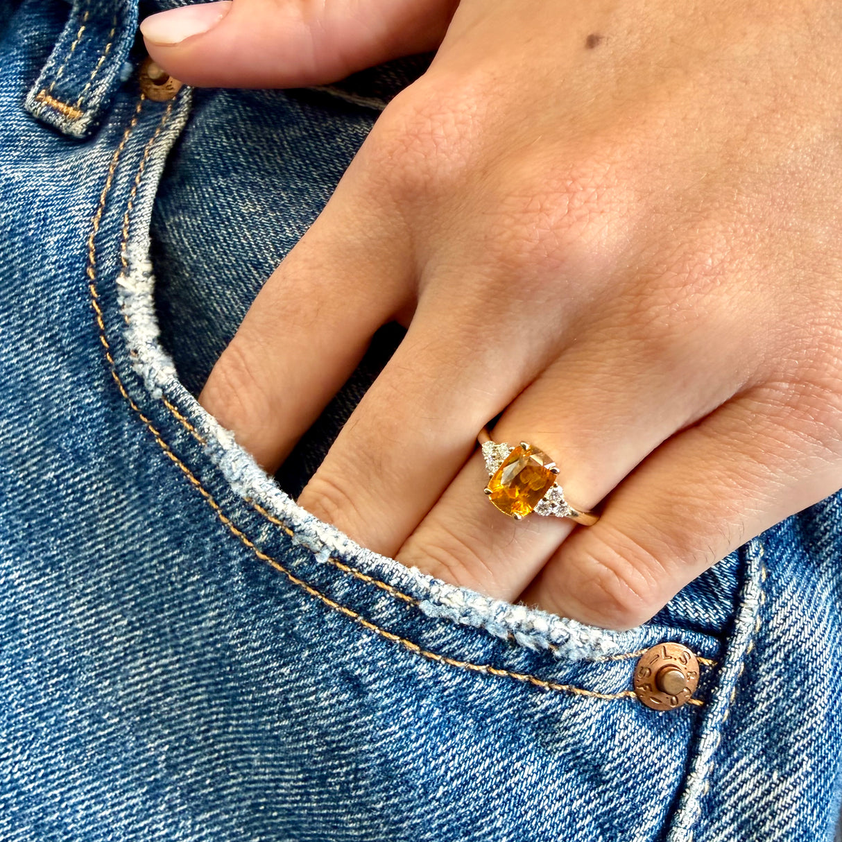 Orange cushion-cut sapphire and diamond cluster tre-foil ring