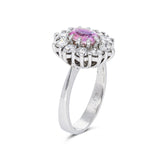Peach pink sapphire diamond cluster ring, side view.