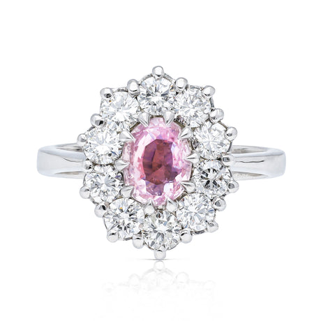Peach pink sapphire diamond cluster ring, front view.