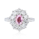 Peach pink sapphire diamond cluster ring, front view.