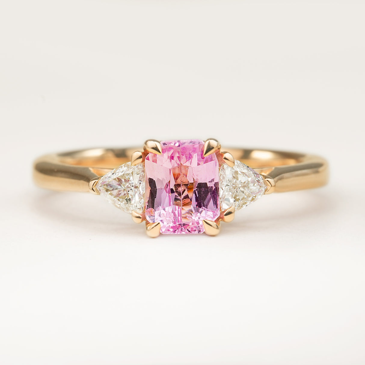 Padparadscha Sapphire and Diamond Three-Stone Engagement Ring