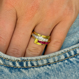 Retro Tiffany & Co. ruby and diamond ring worn on hand in pocket of jeans.