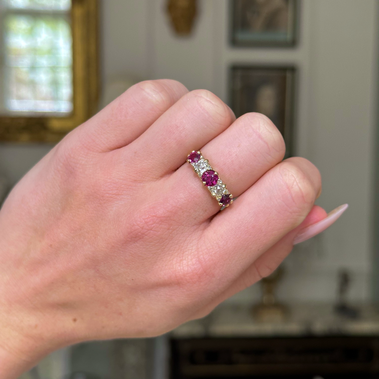 Antique, Edwardian five stone ruby and diamond ring, worn on closed hand. 