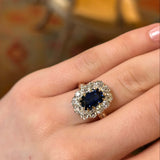 Ring sapphire and diamond cluster on a hand details