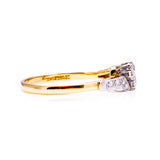 Toi et Moi diamond ring with yellow gold band, side view.