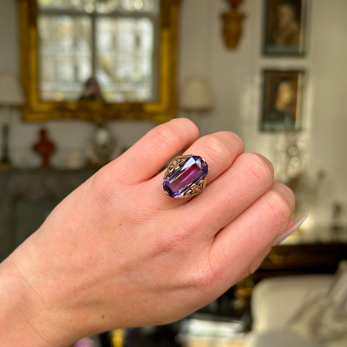 Victorian amethyst and 14ct yellow gold ring worn on closed hand. 
