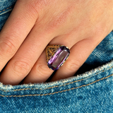 Victorian amethyst and 14ct yellow gold ring worn on hand in pocket of blue jeans.