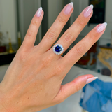 belle epoque sapphire and diamond cluster ring, worn on hand,  front view.