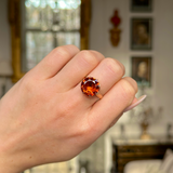 vintage citrine and 18ct yellow gold cocktail ring worn on closed hand. 