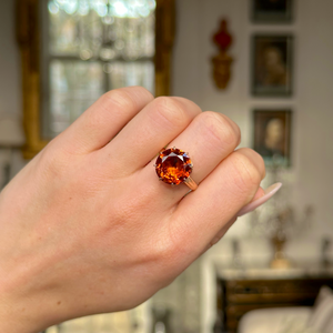 vintage citrine and 18ct yellow gold cocktail ring worn on closed hand.