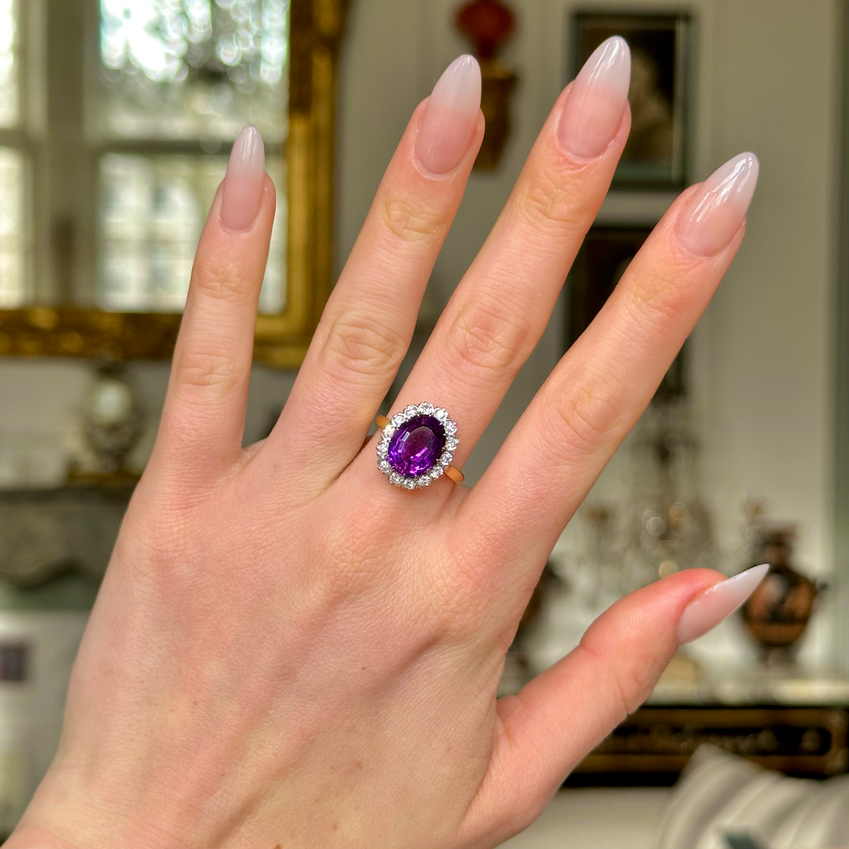 Vintage amethyst and diamond cluster ring, worn on hand. 