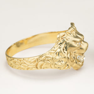 Vintage 1950s old-cut diamond lion’s head ring with diamond-set eyes placed side ways to display fine details of the lion