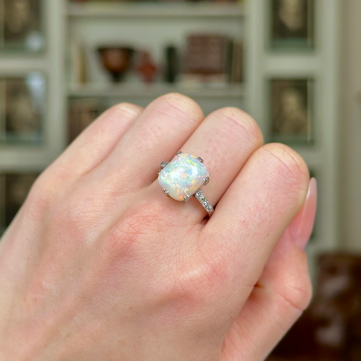 Vintage, Art Deco Cabochon Opal and Diamond Ring, Platinum worn on closed hand.