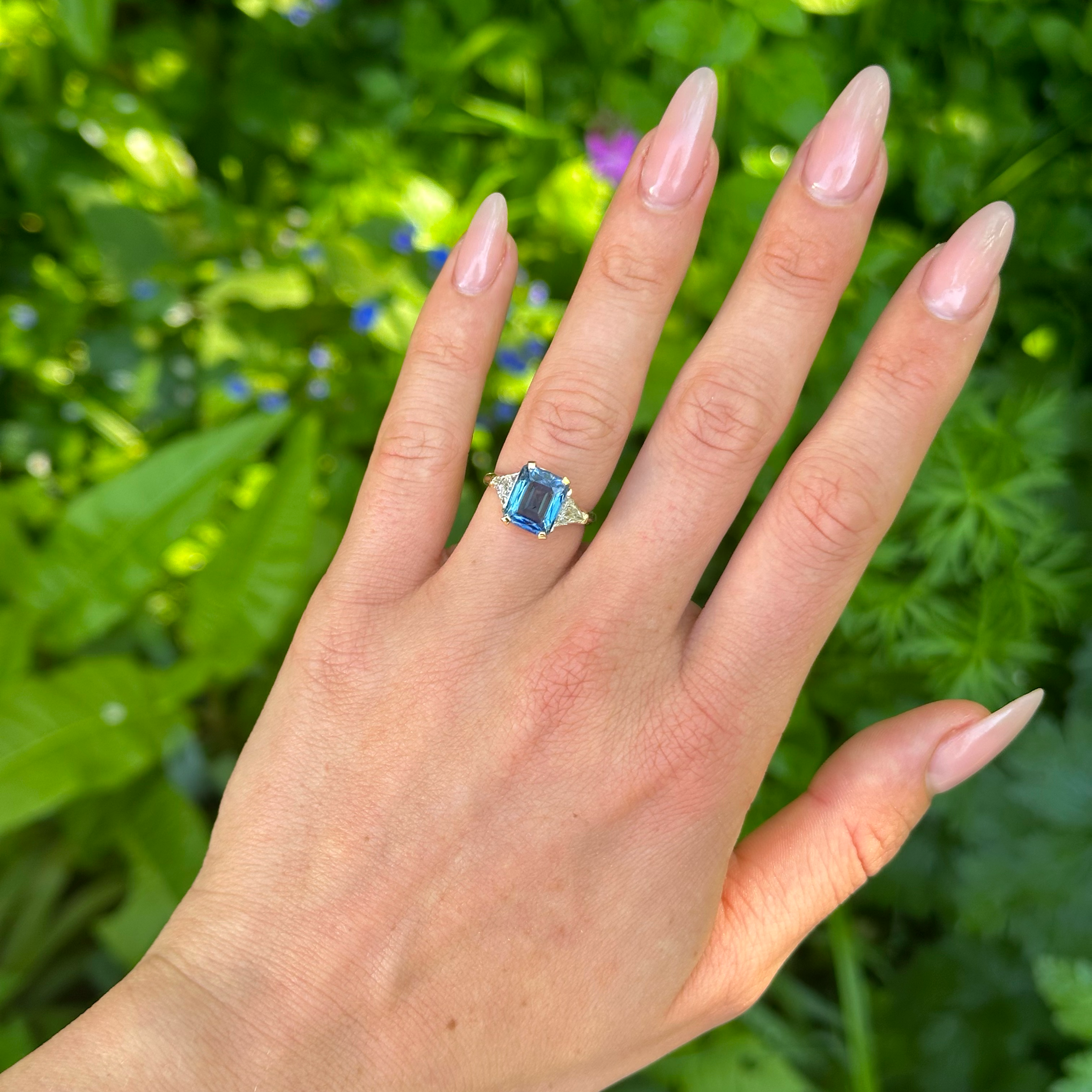 Vintage, Blue Sapphire and Trilliant-cut Diamond Three Stone ring, 18ct Yellow Gold worn on hand