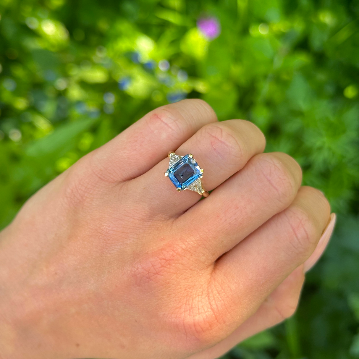 Vintage, Blue Sapphire and Trilliant-cut Diamond Three Stone ring, 18ct Yellow Gold worn on hand.